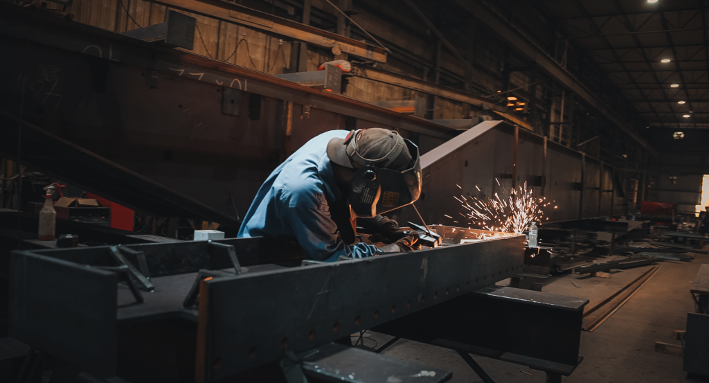 User welding a piece of steel